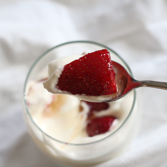 optimistic strawberries with honey in cream.